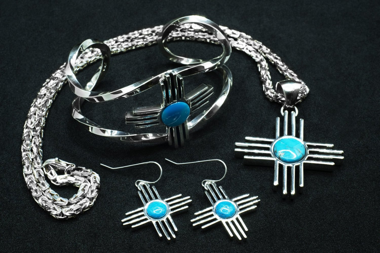 Zia cuff, pendant, and earrings in silver and turquoise